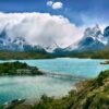 lake near snow-covered mountain during daytime